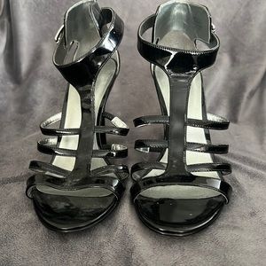 Guess 7.5” black patent leather “cage” sandal with buckle detail at ankle